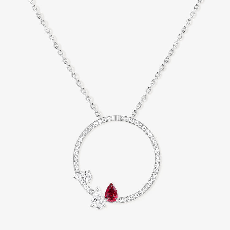 Serti sur Vide pendant in white gold with 2 pear cut diamonds and 1 pear cut ruby