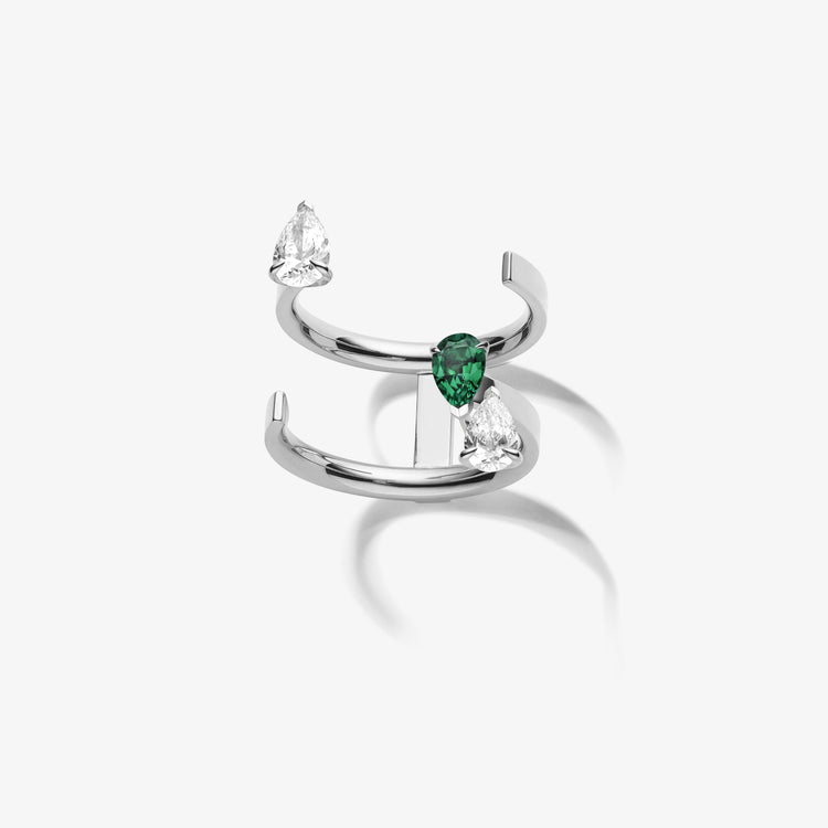 Serti sur Vide ring in white gold with 2 pear shape diamonds and 1 pear shape emerald