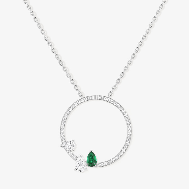 Serti sur Vide pendant in white gold with 2 pear cut diamonds and 1 pear cut emerald