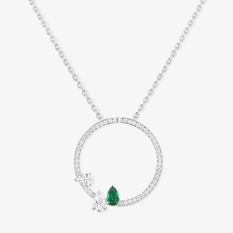 Serti sur Vide pendant in white gold with 2 diamonds and 1 emerald