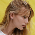 Serti sur Vide earring in white gold